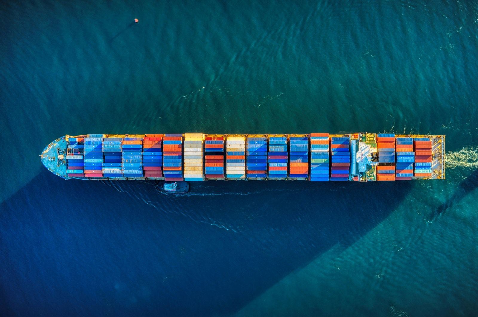 Container ship at sea carrying export containers